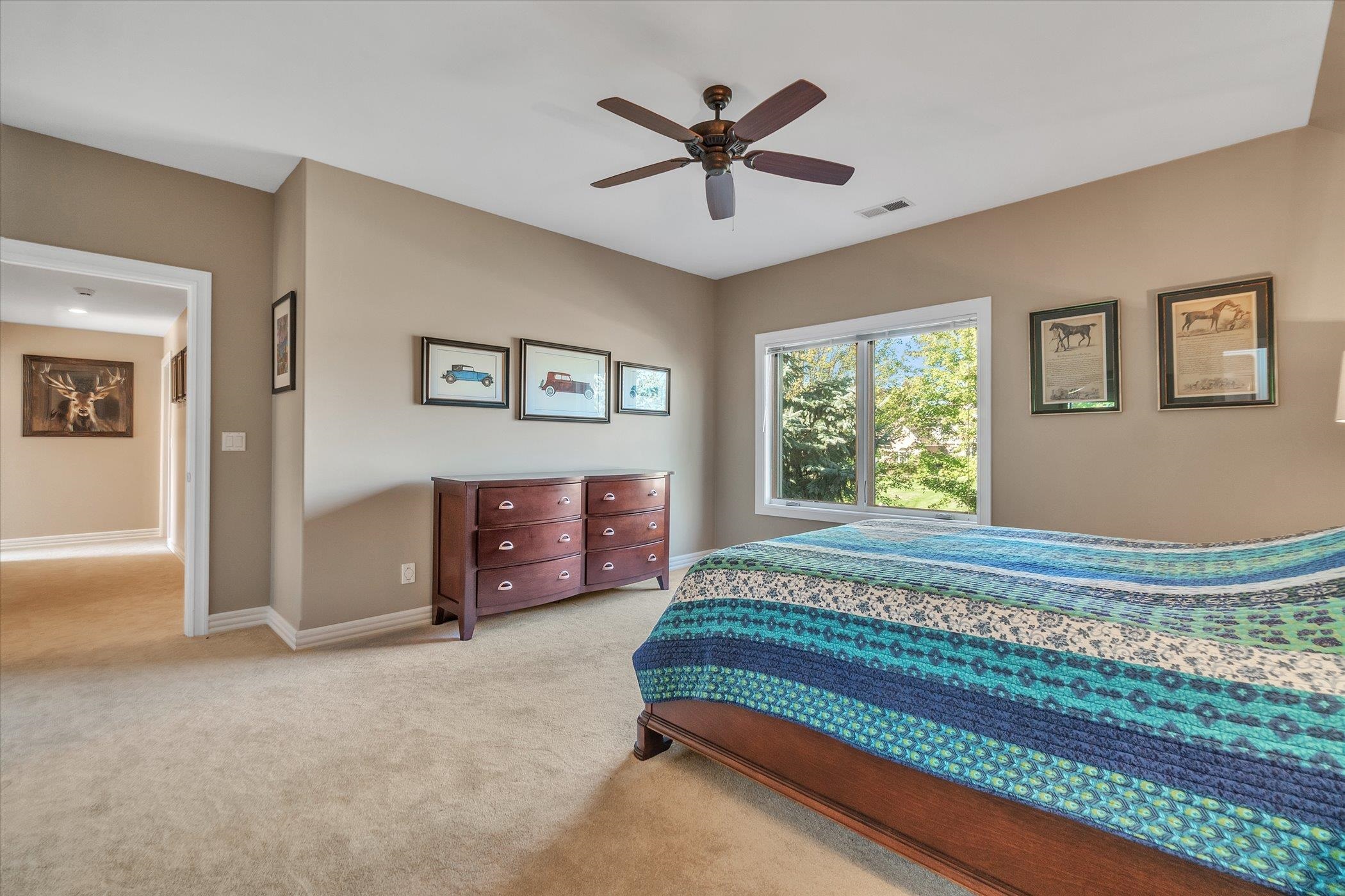 12535 Bellingham Road Caledonia, IL 61011 - Photo 46 of 57 a bedroom with a bed and a large window