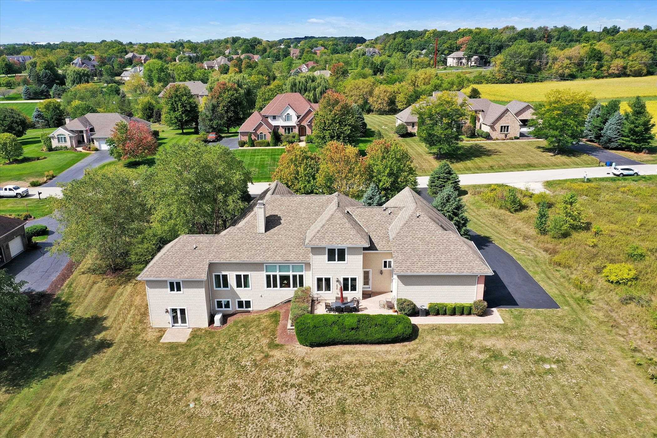 12535 Bellingham Road Caledonia, IL 61011 - Photo 49 of 57 an aerial view of residential houses with outdoor space and trees