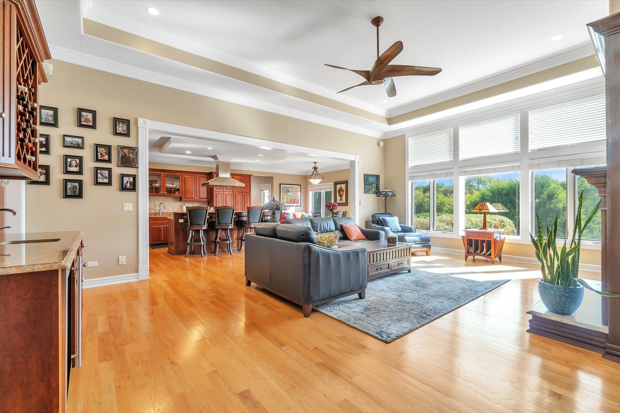 12535 Bellingham Road Caledonia, IL 61011 - Photo 7 of 57 a living room with furniture a ceiling fan and a large window
