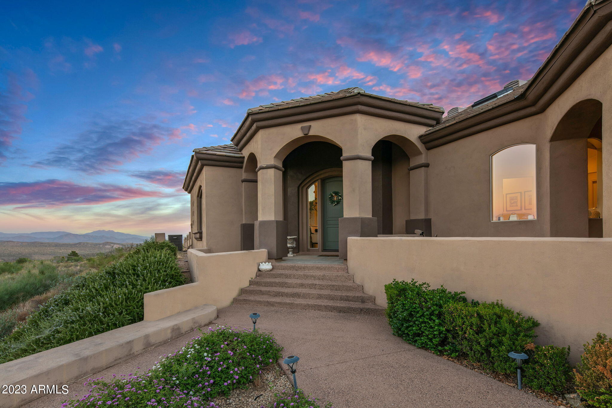 11519 East Blue Wash Road Scottsdale, AZ 85262 - Photo 15 of 42 a front view of a house with a garden