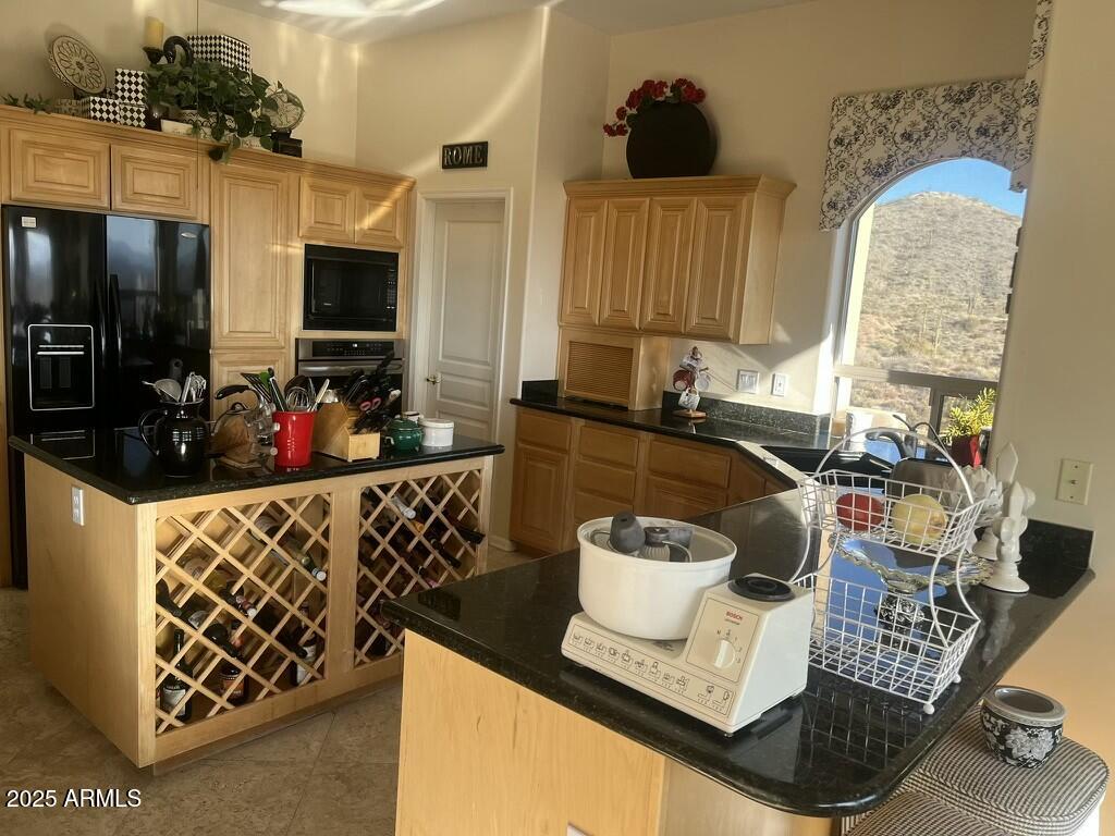 11519 East Blue Wash Road Scottsdale, AZ 85262 - Photo 27 of 42 a kitchen with a sink and a stove top oven