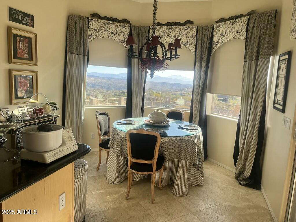 11519 East Blue Wash Road Scottsdale, AZ 85262 - Photo 3 of 42 a dining room with furniture and a window