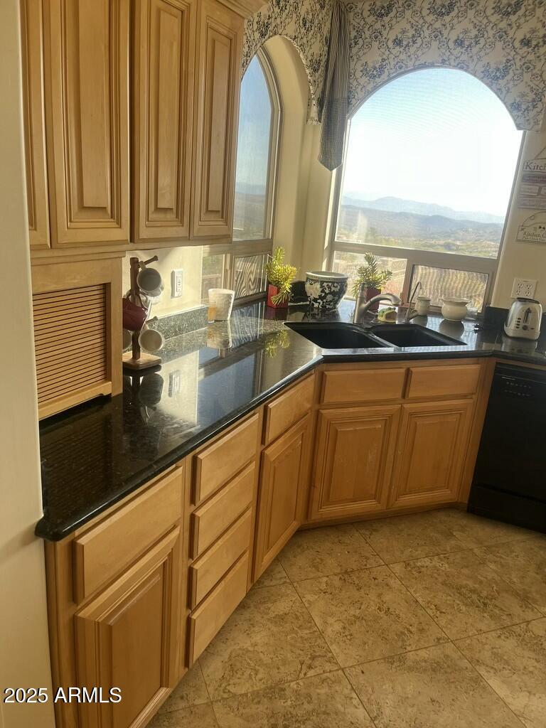 11519 East Blue Wash Road Scottsdale, AZ 85262 - Photo 40 of 42 a kitchen with stainless steel appliances granite countertop a sink and cabinets