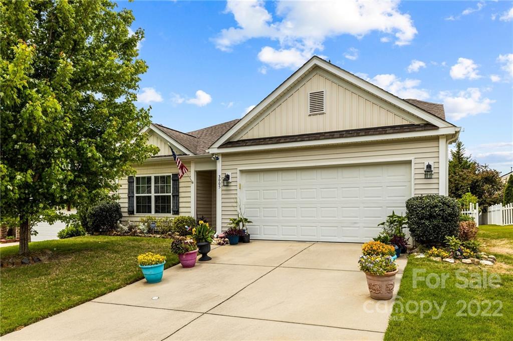 3005 Arthur Road, Unit 170 Indian Land, SC 29707 - Photo 2 of 38 a front view of a house with a garden