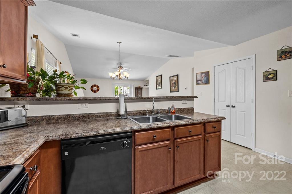 3005 Arthur Road, Unit 170 Indian Land, SC 29707 - Photo 22 of 38 a kitchen with cabinets granite counter tops and a sink