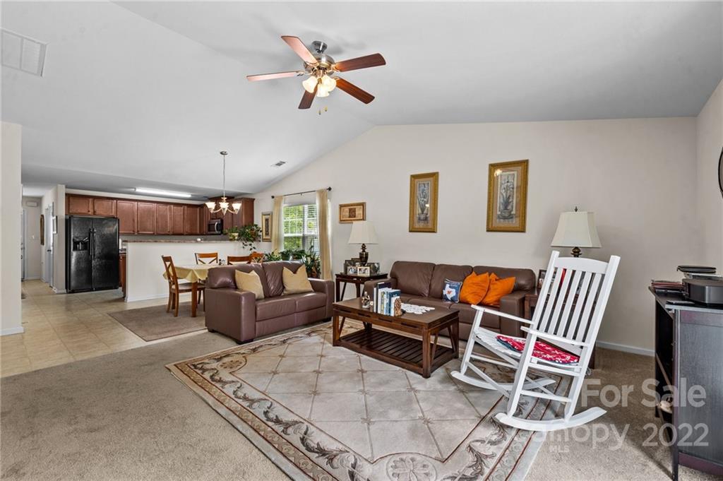 3005 Arthur Road, Unit 170 Indian Land, SC 29707 - Photo 27 of 38 a living room with furniture and kitchen view