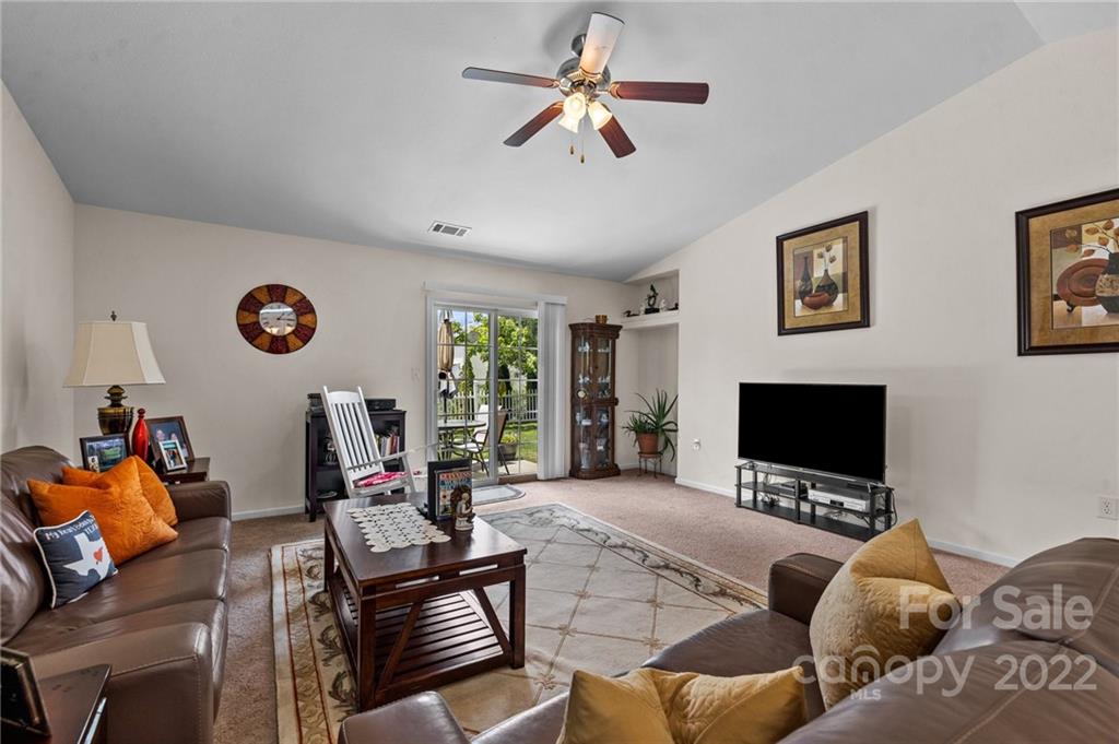 3005 Arthur Road, Unit 170 Indian Land, SC 29707 - Photo 29 of 38 a living room with furniture a ceiling fan and a flat screen tv