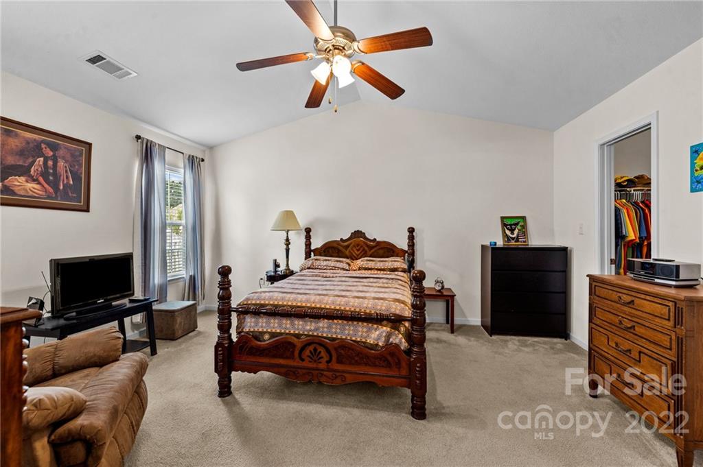 3005 Arthur Road, Unit 170 Indian Land, SC 29707 - Photo 34 of 38 a bedroom with a bed and a flat screen tv