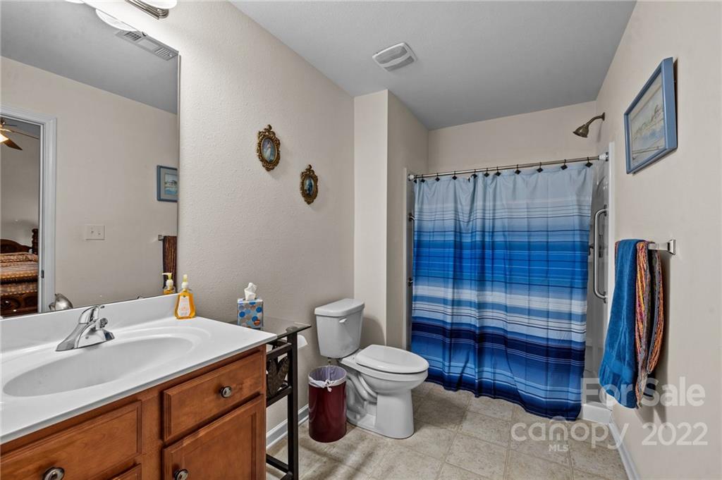 3005 Arthur Road, Unit 170 Indian Land, SC 29707 - Photo 37 of 38 a bathroom with a sink a toilet and shower