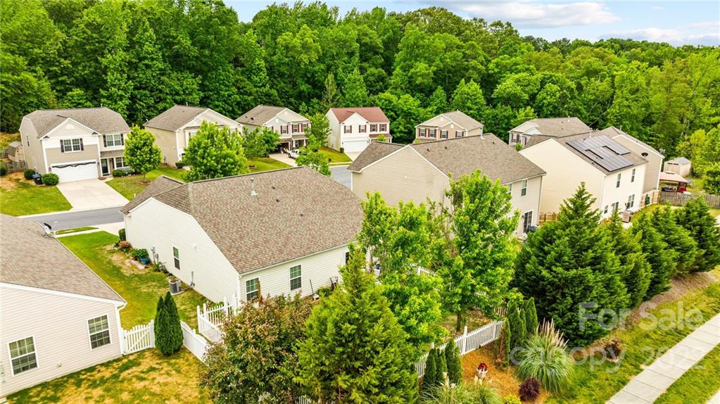 3005 Arthur Road, Unit 170 Indian Land, SC 29707 - Photo 7 of 38 a aerial view of a house with swimming pool and large trees