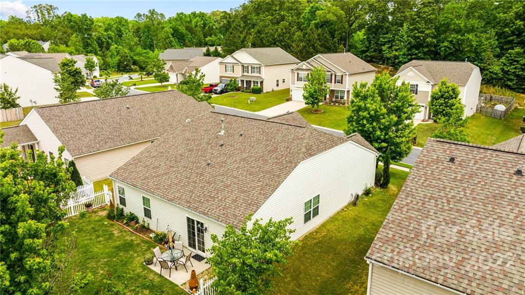 3005 Arthur Road, Unit 170 Indian Land, SC 29707 - Photo 8 of 38 an aerial view of a house with swimming pool and large trees