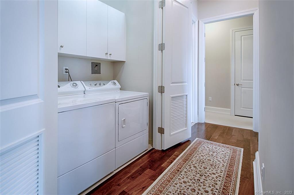 100 Stone Ridge Way, Unit 1H Fairfield, CT 06824 - Photo 12 of 30 a view of utility room with washer and dryer