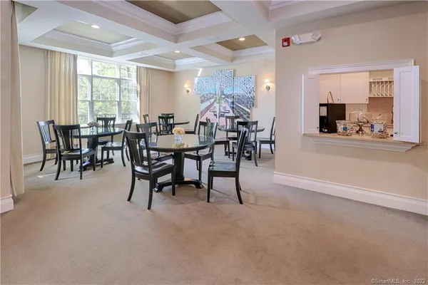 a view of a livingroom with furniture and a dining table