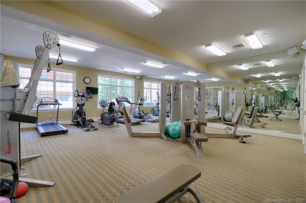 100 Stone Ridge Way, Unit 1H Fairfield, CT 06824 - Photo 27 of 30 a view of a room with gym equipment