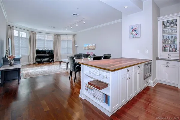 a view of a dining room with furniture and wooden floor