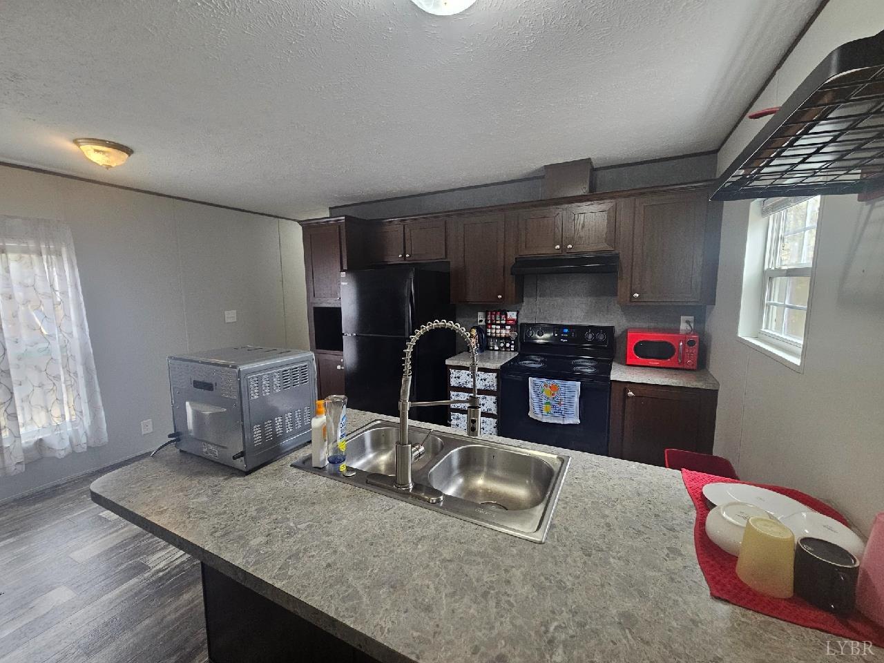 415 Plum Branch Road Lynchburg, VA 24504 - Photo 3 of 17 a kitchen with sink and refrigerator