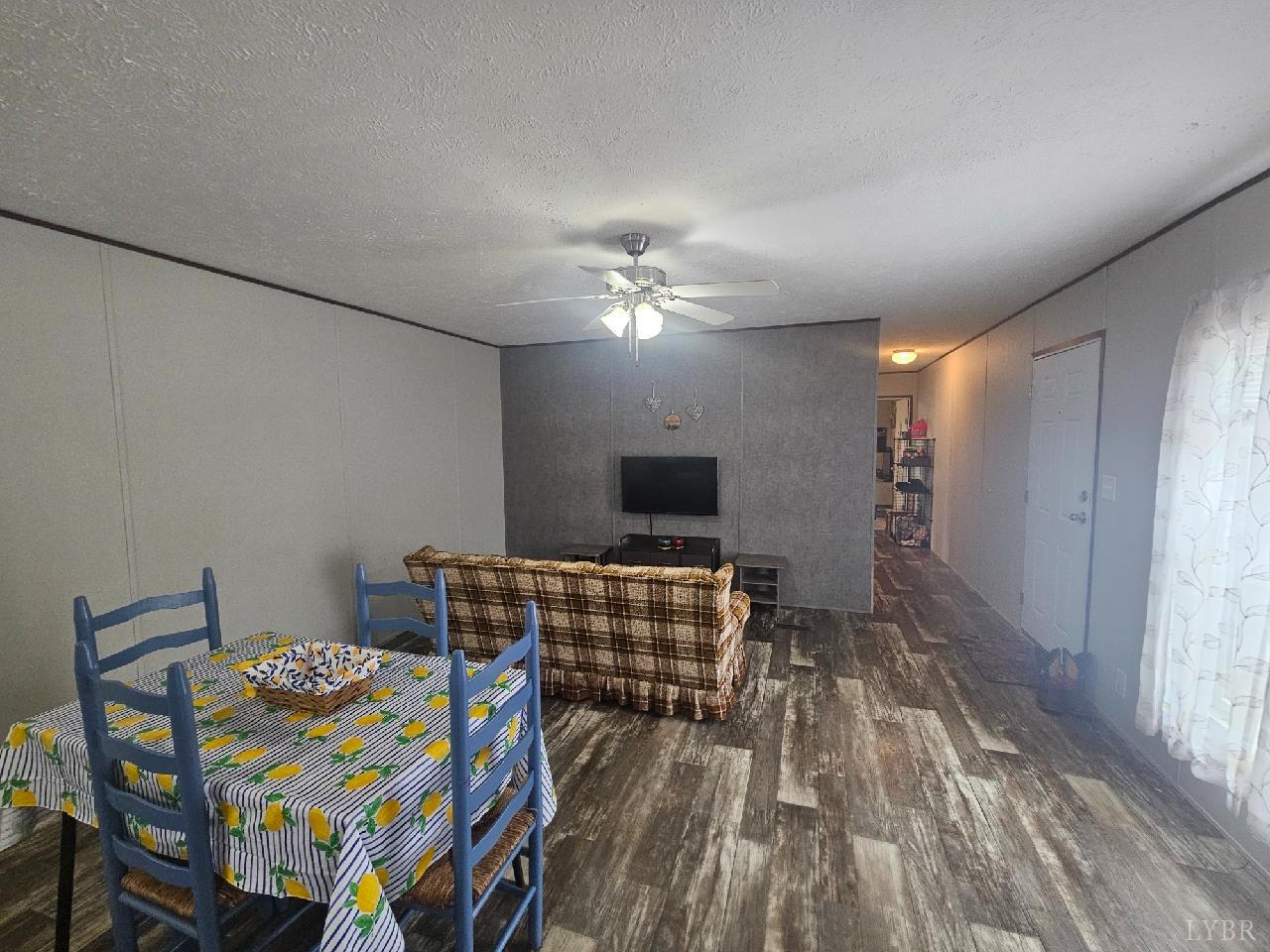 415 Plum Branch Road Lynchburg, VA 24504 - Photo 5 of 17 a living room with furniture and a wooden floor
