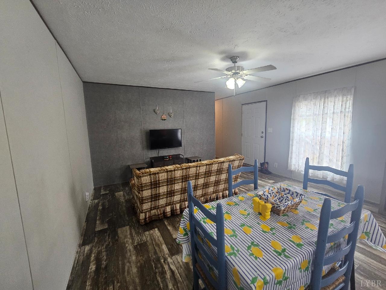 415 Plum Branch Road Lynchburg, VA 24504 - Photo 6 of 17 a living room with furniture and a flat screen tv