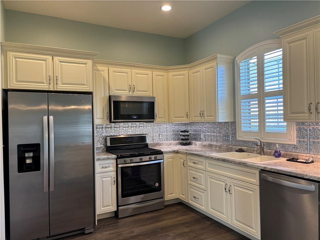 901 Valentina Lane Lower Burrell, PA 15068 - Photo 3 of 25 a kitchen with white cabinets and stainless steel appliances