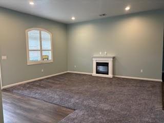 901 Valentina Lane Lower Burrell, PA 15068 - Photo 8 of 25 an empty room with windows and fireplace
