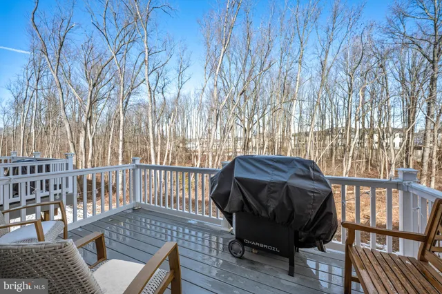 a view of a chair and table on the wooden floor