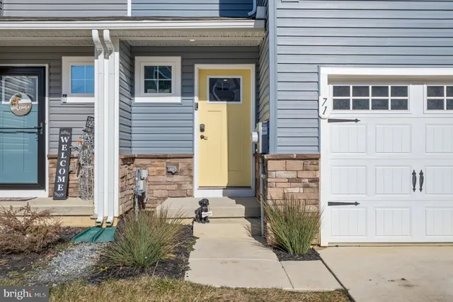 a front view of a house with large windows