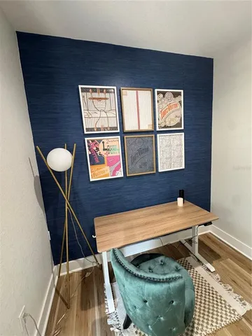 a room with furniture pool table and windows