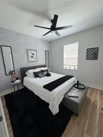 a bedroom with a bed and a table