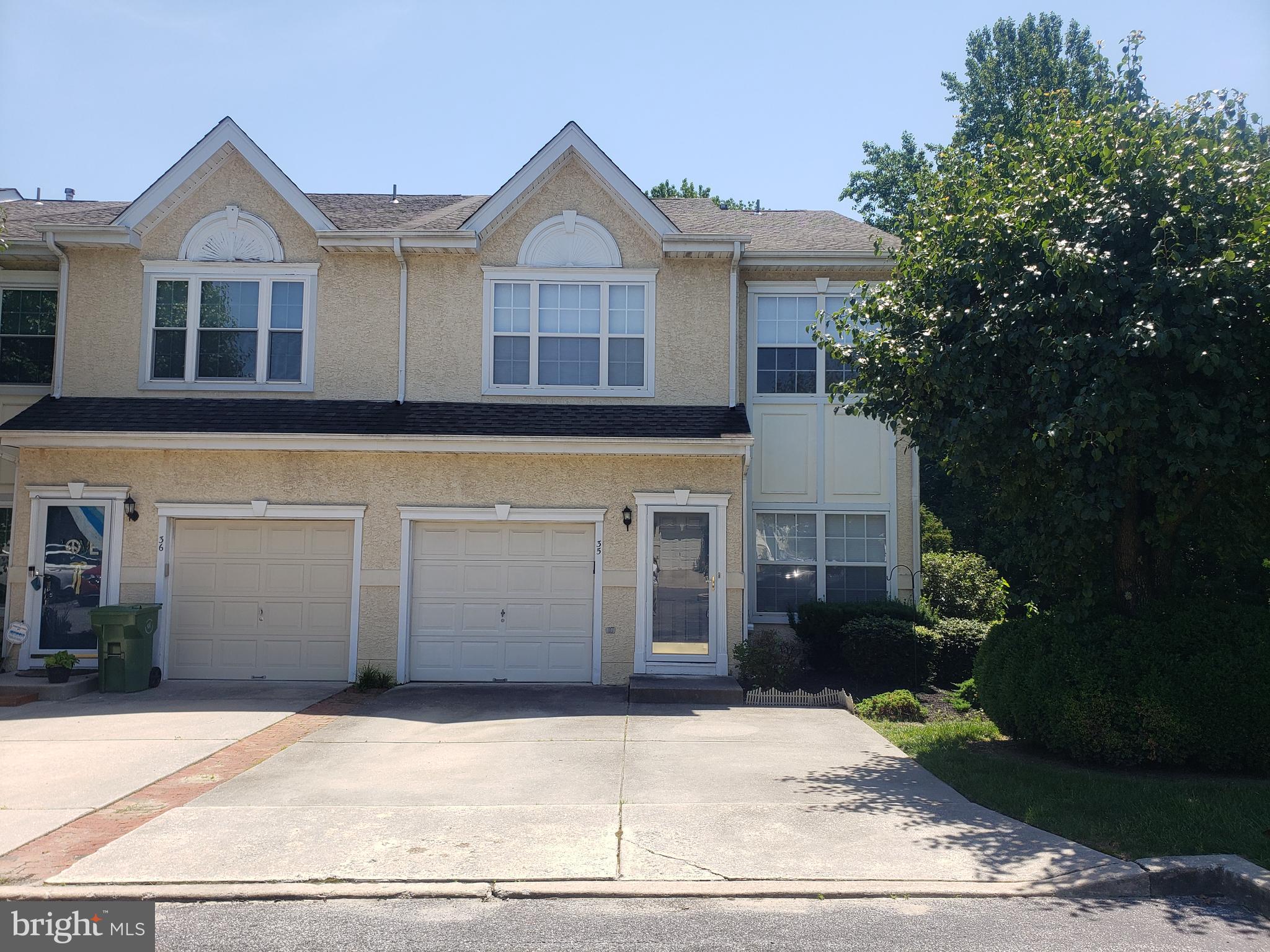 35 Versailles Boulevard Cherry Hill, NJ 08003 - Photo 15 of 16 a front view of a house with a yard and garage