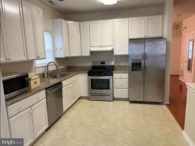 35 Versailles Boulevard Cherry Hill, NJ 08003 - Photo 3 of 16 a kitchen with granite countertop white cabinets and stainless steel appliances
