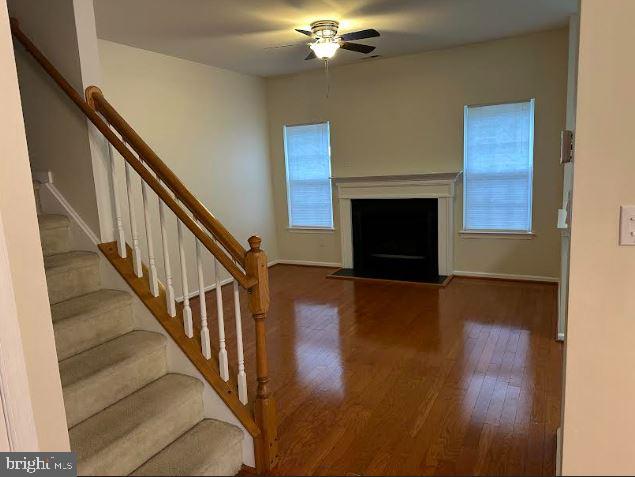 35 Versailles Boulevard Cherry Hill, NJ 08003 - Photo 5 of 16 a view of a livingroom with wooden floor and a fireplace