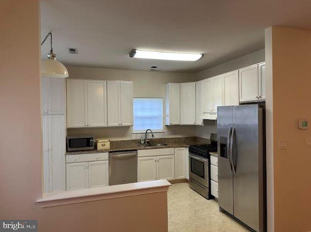 35 Versailles Boulevard Cherry Hill, NJ 08003 - Photo 7 of 16 a kitchen with cabinets stainless steel appliances and a counter space