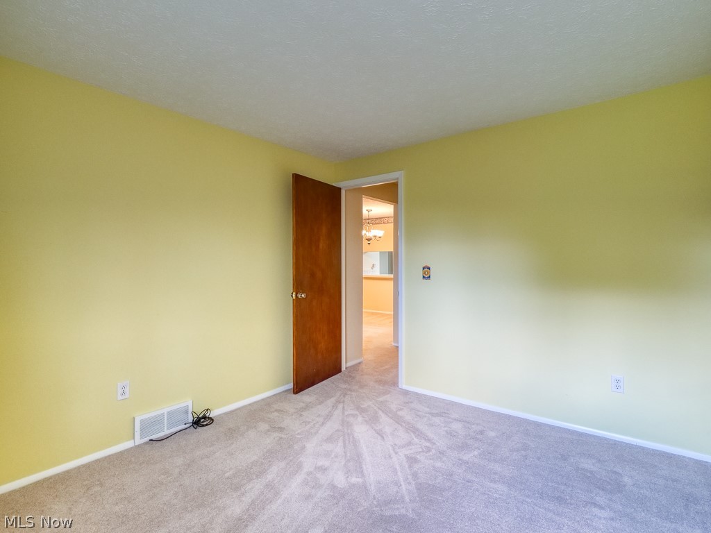 8941 West Ridge Road, Unit A Elyria, OH 44035 - Photo 23 of 30 Empty room with light carpet