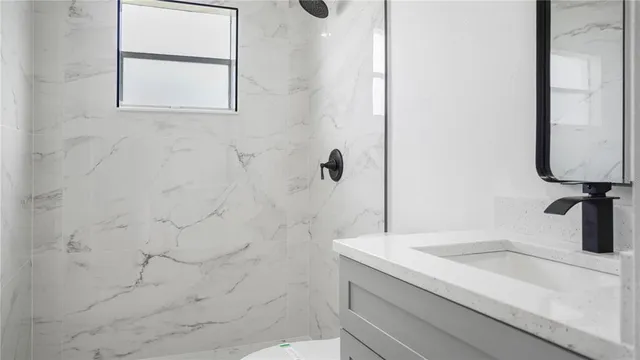 an empty room with painting on the wall