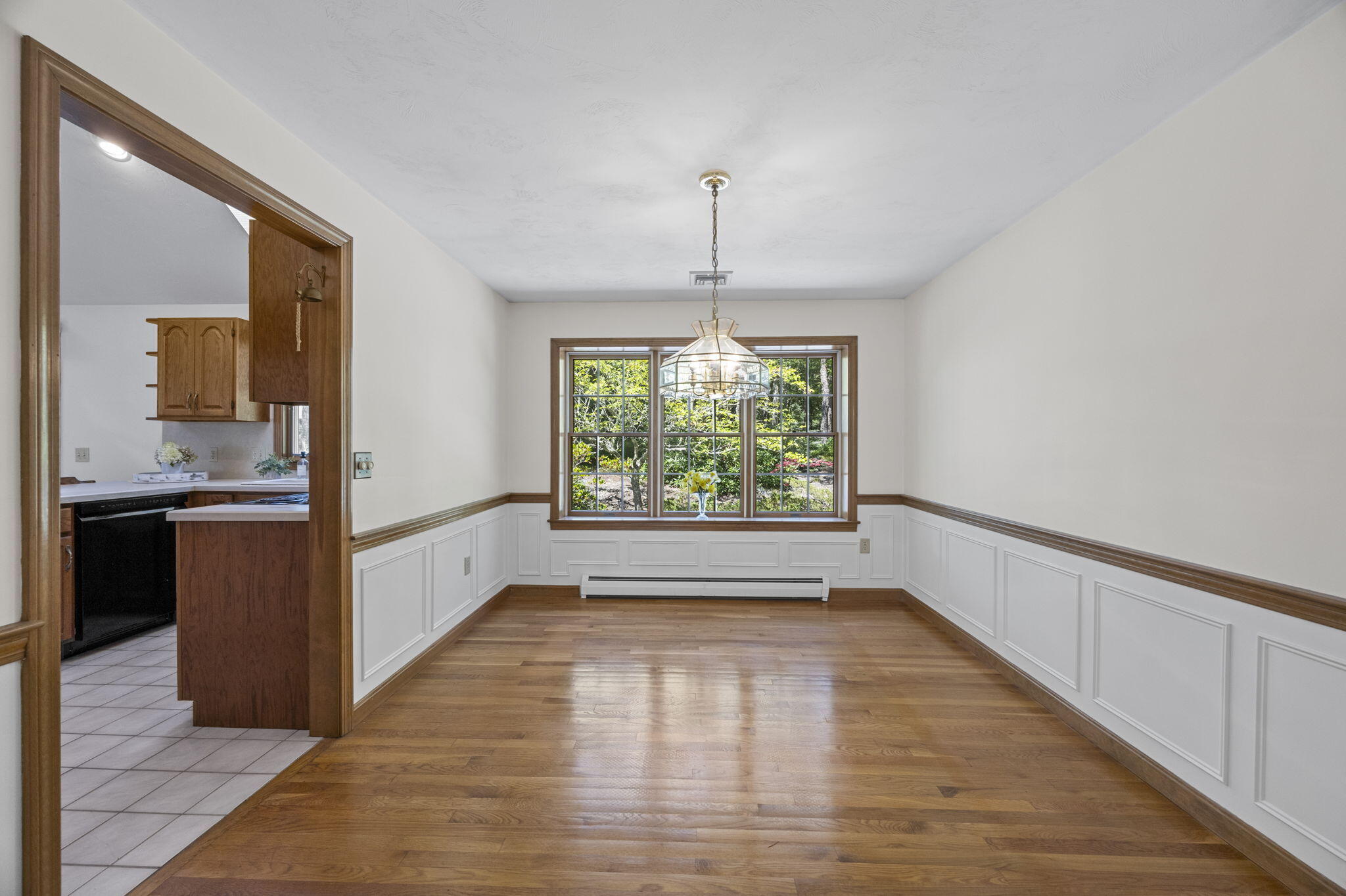 19 Fishermans Landing Road Brewster, MA 02631 - Photo 17 of 58 a view of a kitchen with a sink and dishwasher with wooden floor