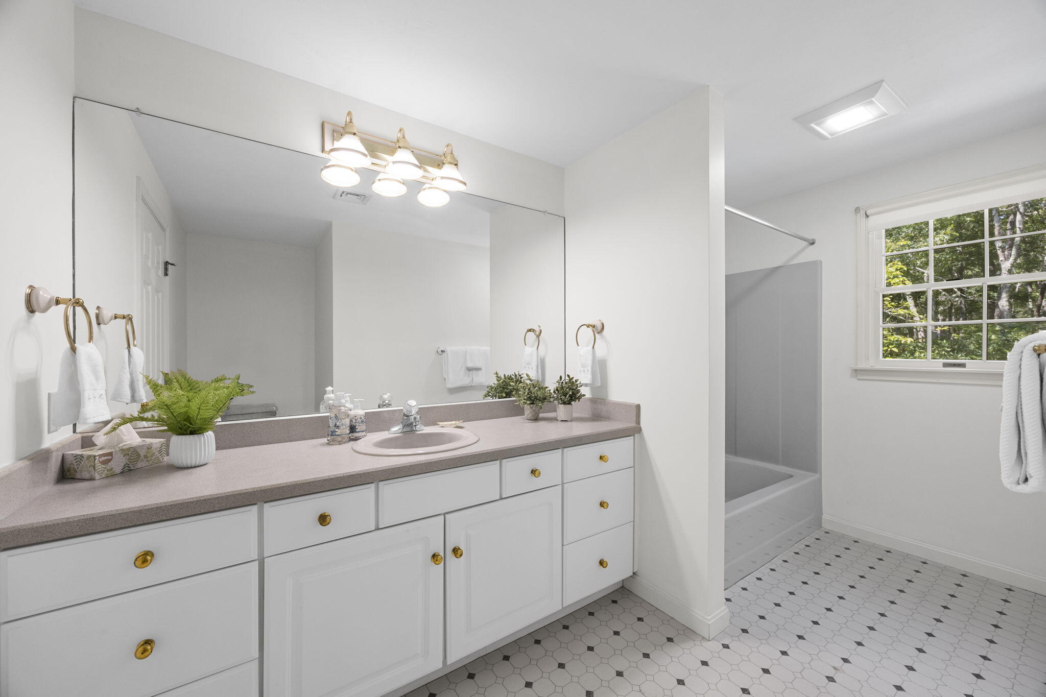 19 Fishermans Landing Road Brewster, MA 02631 - Photo 34 of 58 a bathroom with a double vanity sink a mirror and a shower