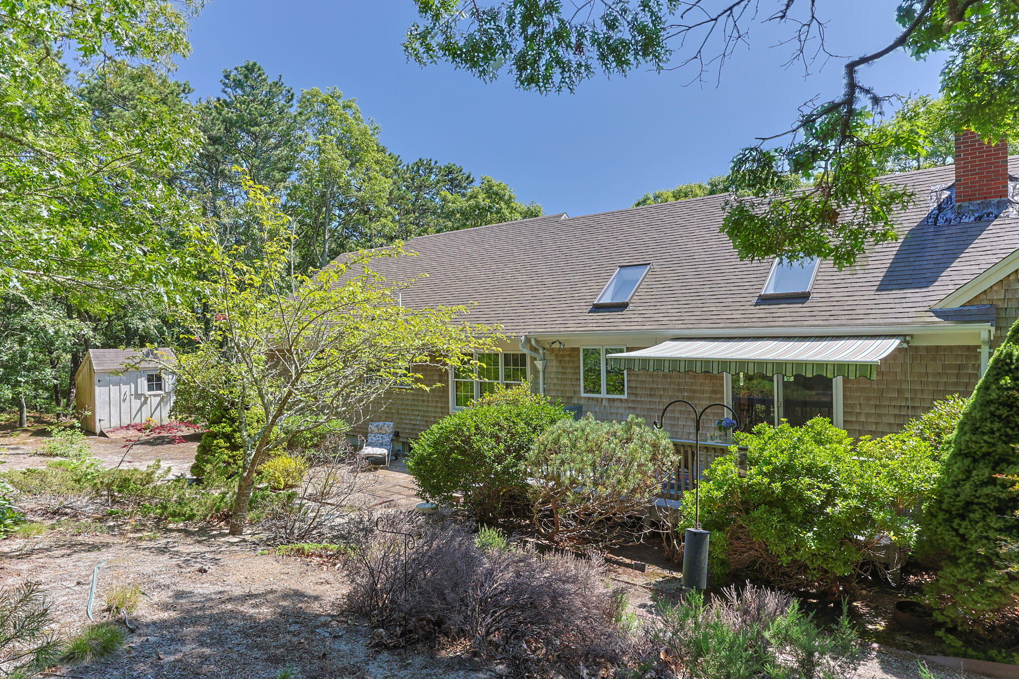 19 Fishermans Landing Road Brewster, MA 02631 - Photo 46 of 58 a front view of a house with garden