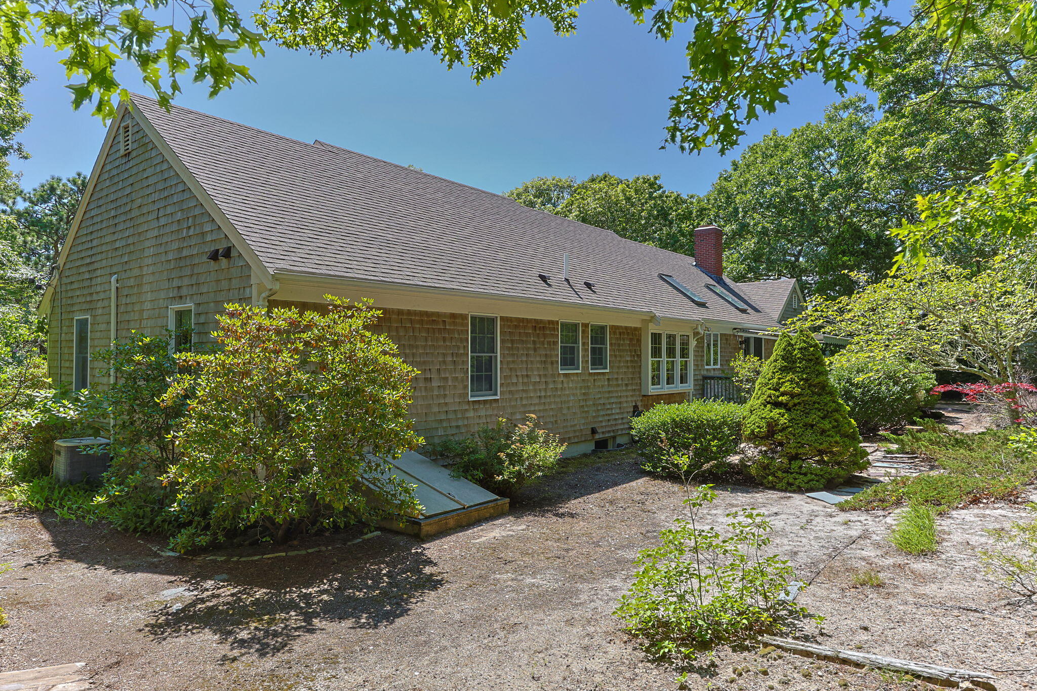 19 Fishermans Landing Road Brewster, MA 02631 - Photo 48 of 58 a front view of a house with garden