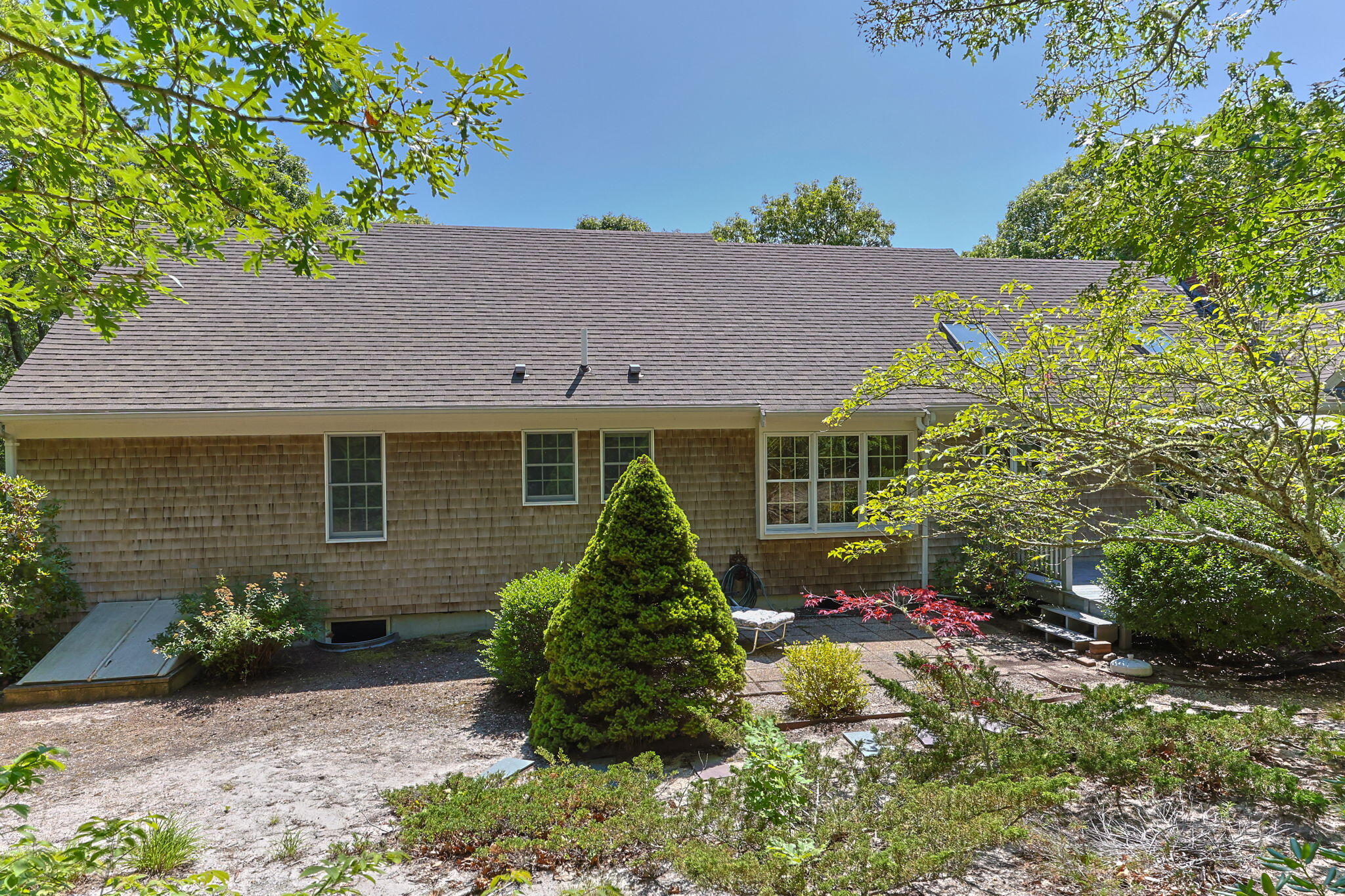 19 Fishermans Landing Road Brewster, MA 02631 - Photo 49 of 58 a front view of a house with a garden