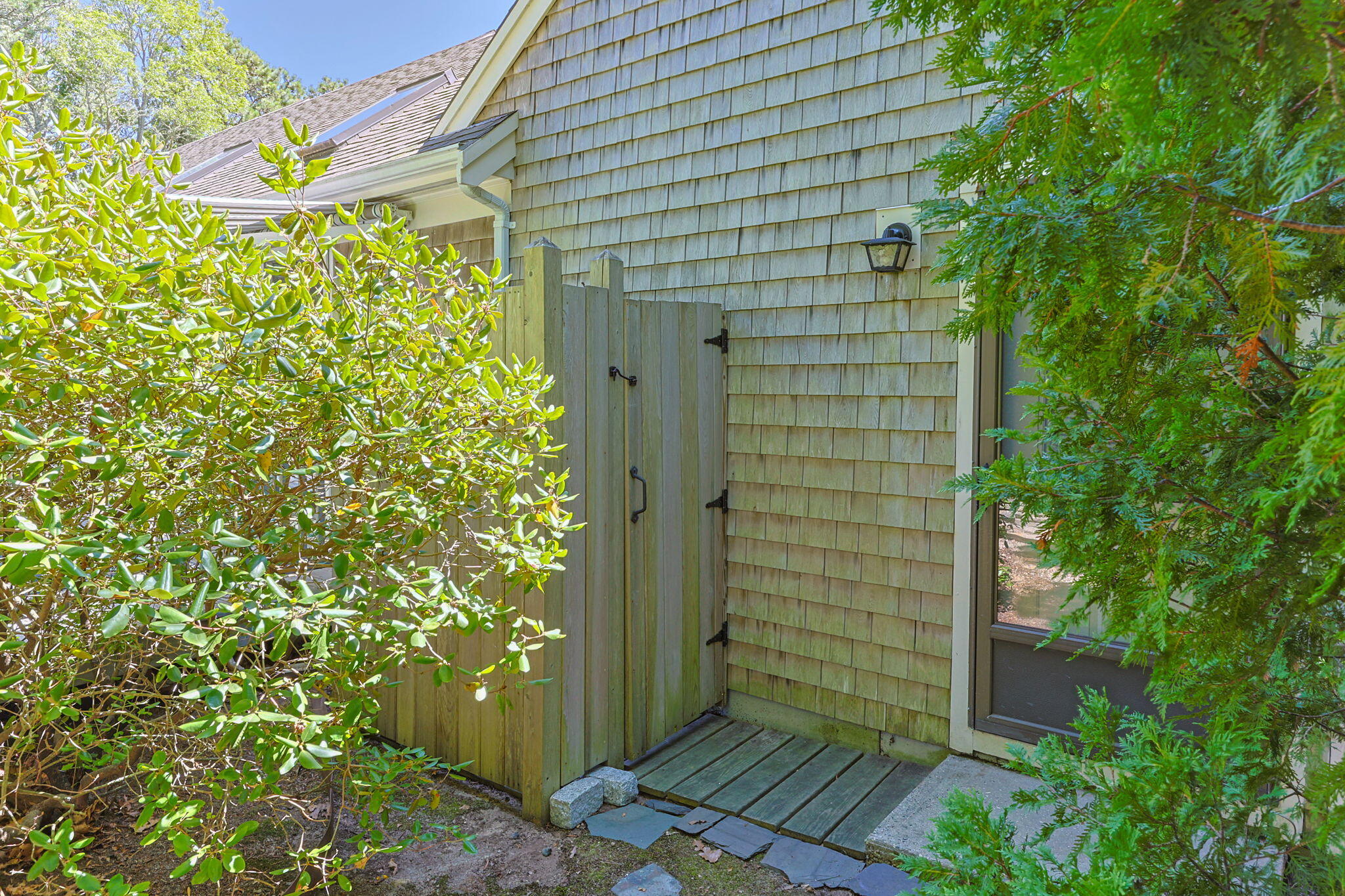 19 Fishermans Landing Road Brewster, MA 02631 - Photo 52 of 58 a view of a wooden door and a tree