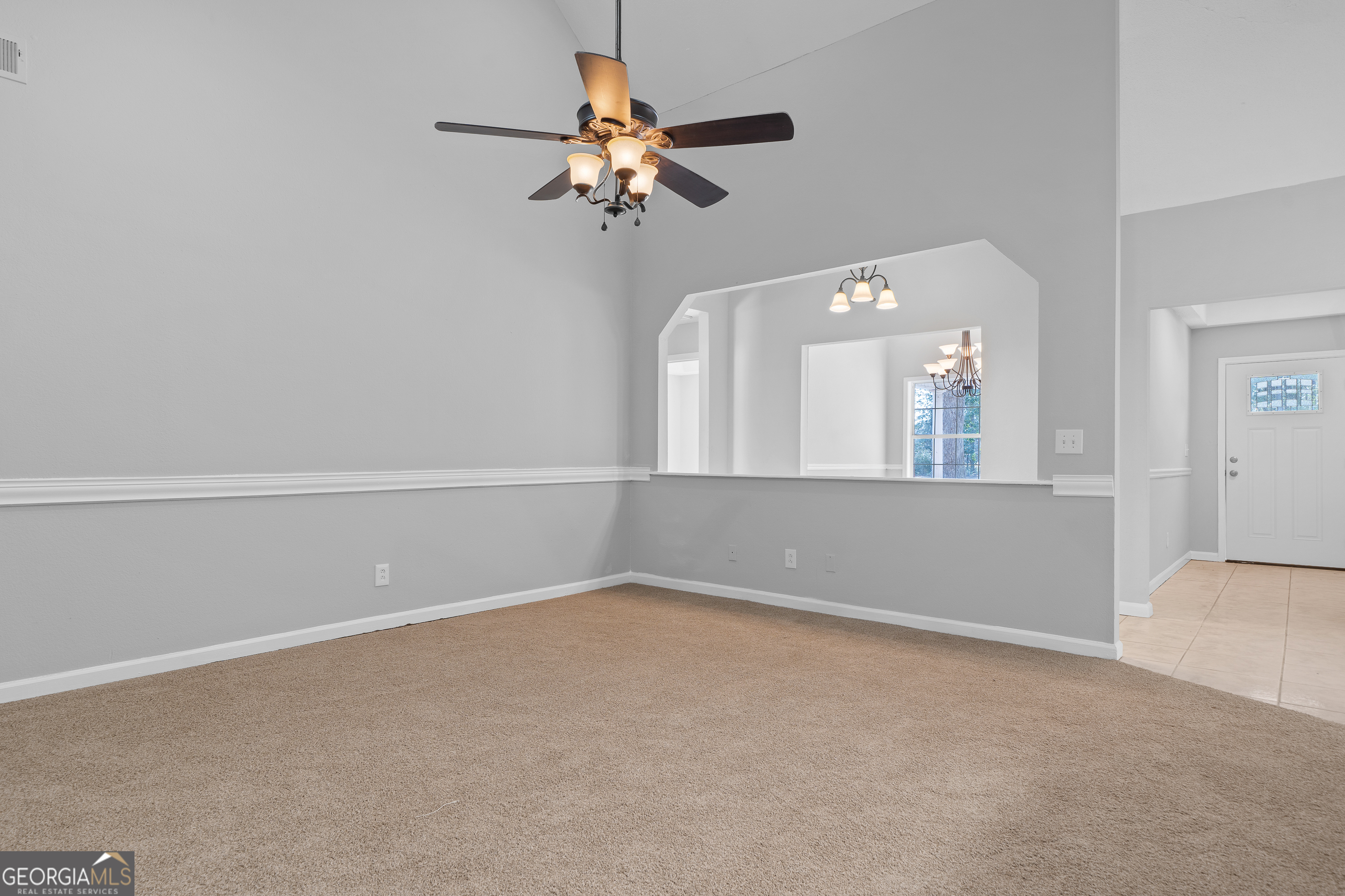 7513 Columbus Road Lizella, GA 31052 - Photo 15 of 54 a view of an empty room with a chandelier fan
