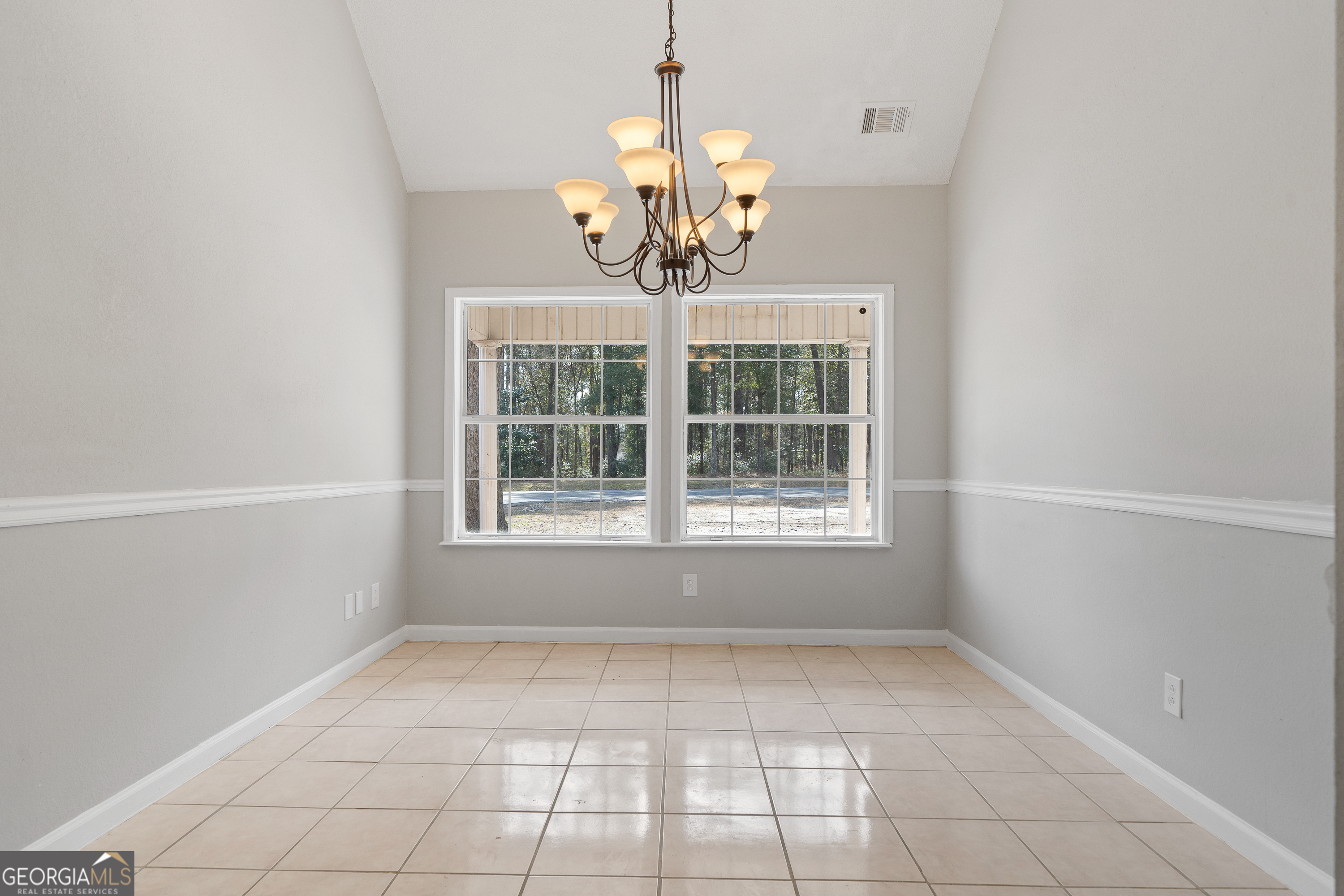 7513 Columbus Road Lizella, GA 31052 - Photo 18 of 54 a view of an empty room with a window