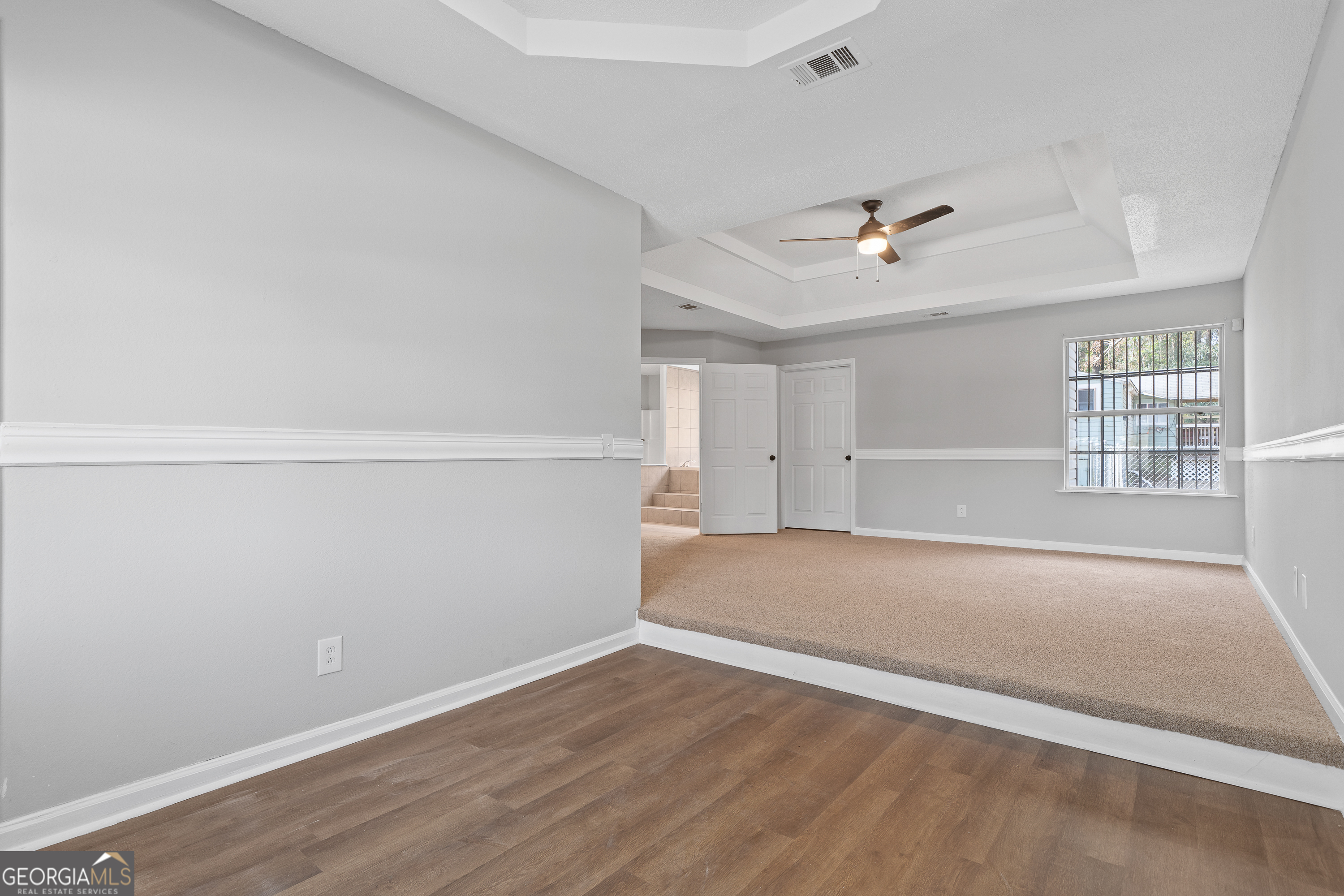 7513 Columbus Road Lizella, GA 31052 - Photo 30 of 54 an empty room with a empty space and windows