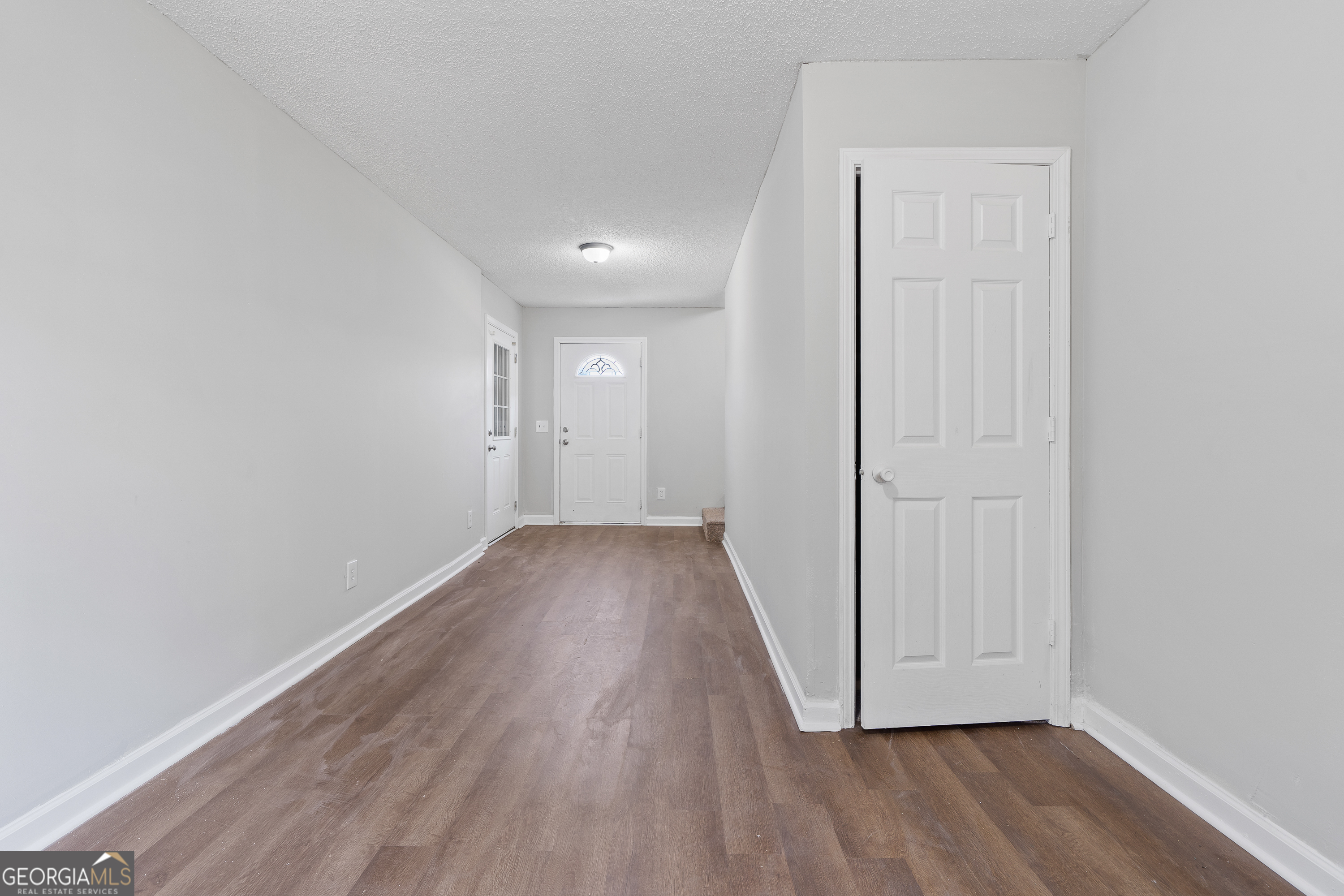7513 Columbus Road Lizella, GA 31052 - Photo 36 of 54 a view of hallway with wooden floor