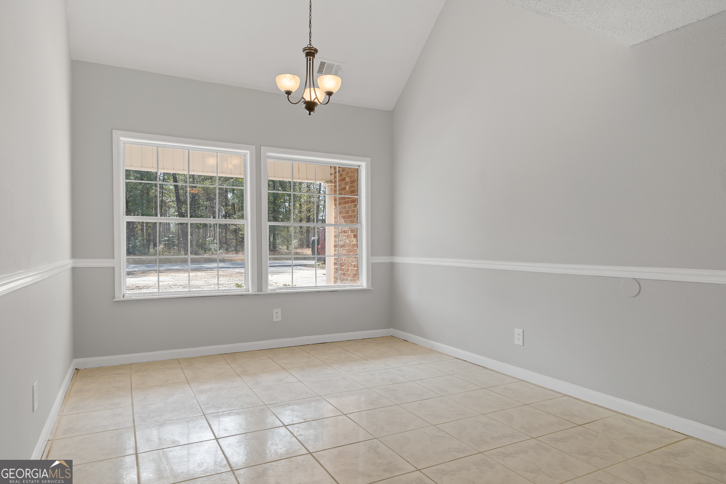 7513 Columbus Road Lizella, GA 31052 - Photo 5 of 54 a view of empty room with windows