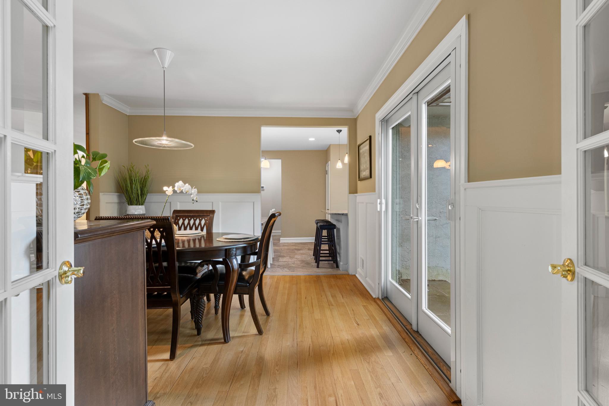413 Hawthorne Road Wallingford, PA 19086 - Photo 11 of 52 a view of a dining room with furniture and a chandelier