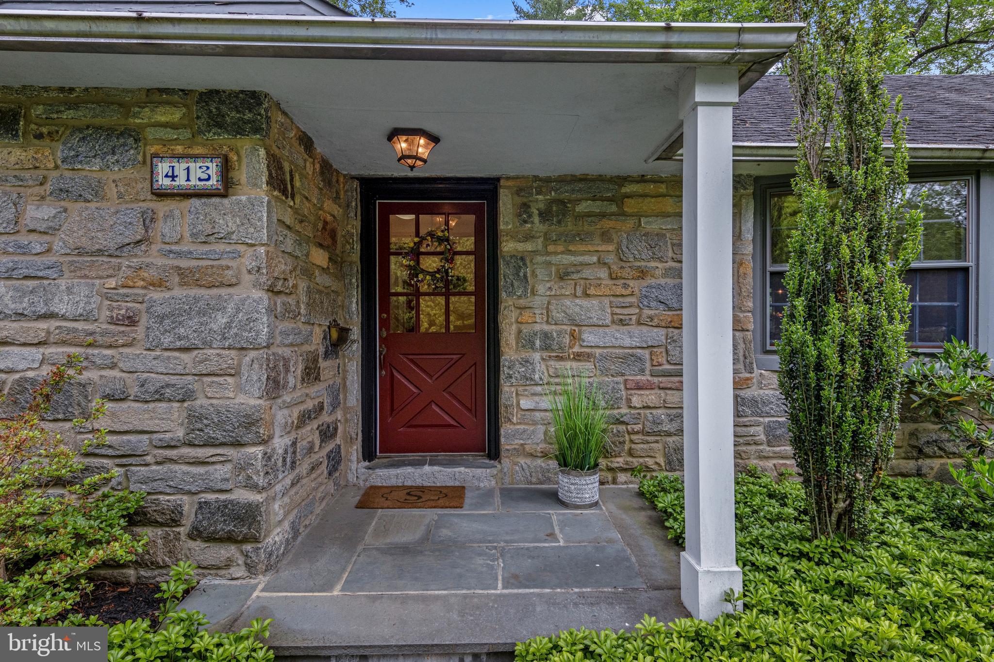 413 Hawthorne Road Wallingford, PA 19086 - Photo 2 of 52 a front view of a house with plants