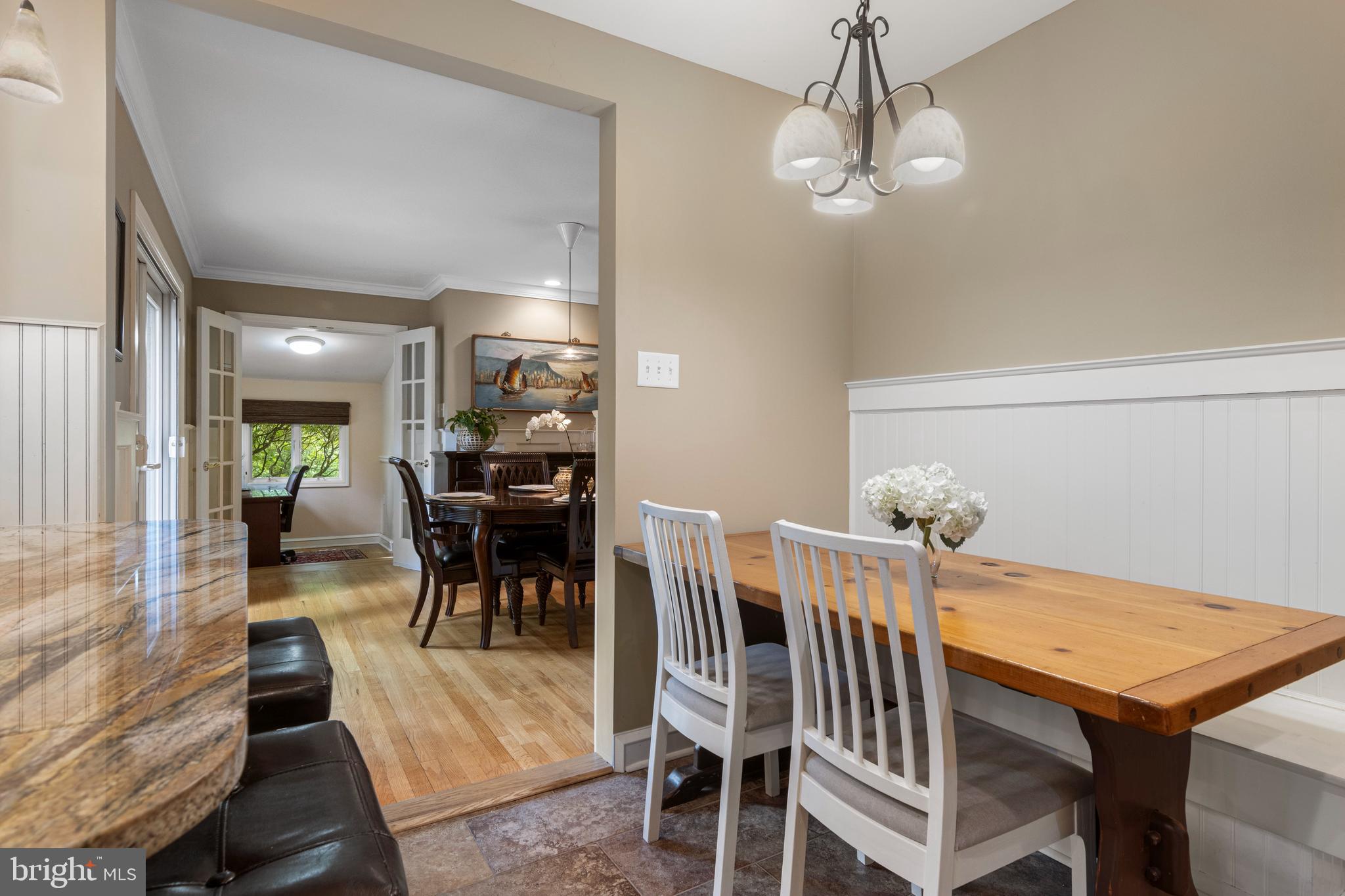 413 Hawthorne Road Wallingford, PA 19086 - Photo 25 of 52 a view of a dining room with furniture and wooden floor