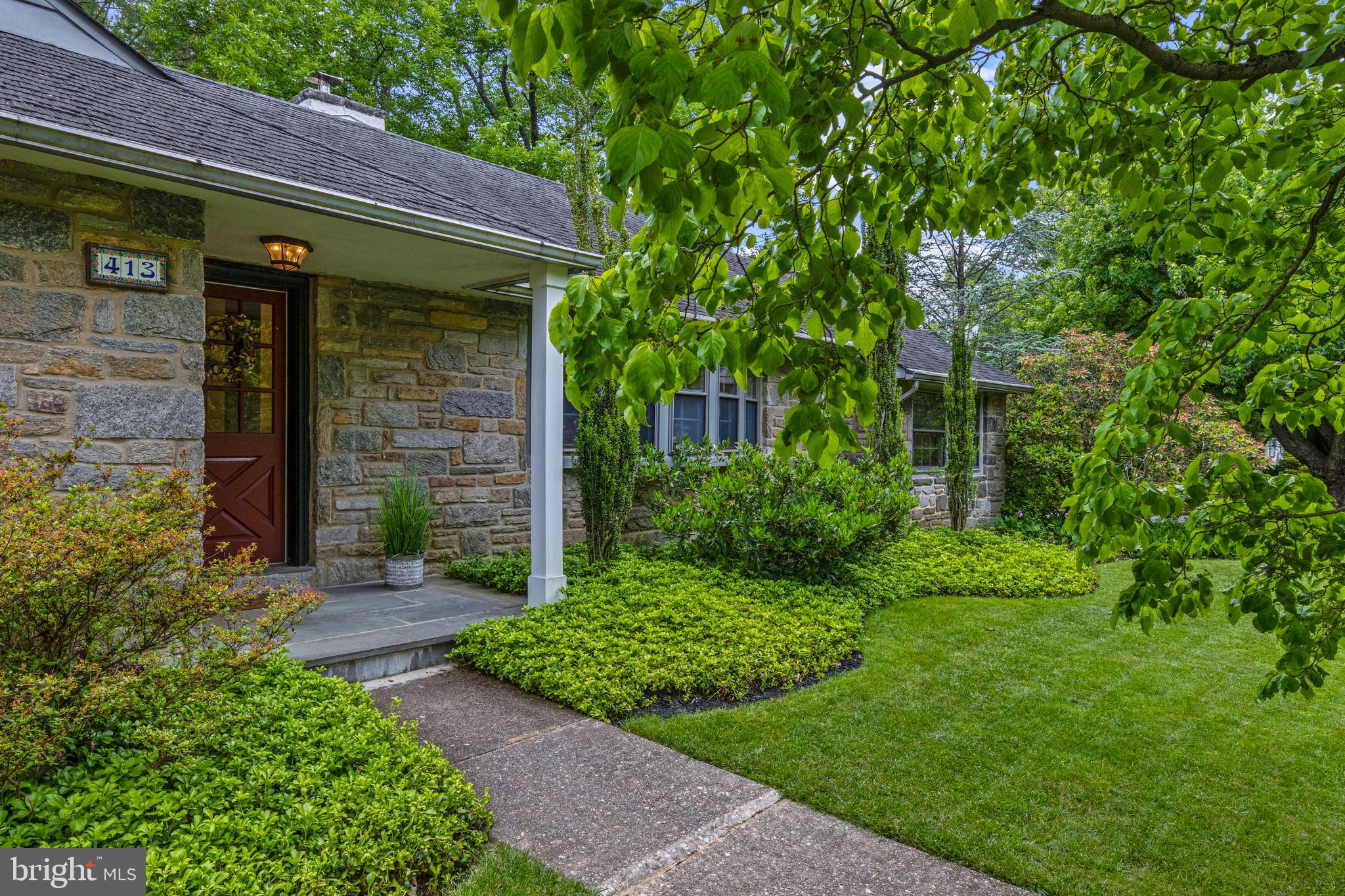 413 Hawthorne Road Wallingford, PA 19086 - Photo 3 of 52 a view of a house with a garden