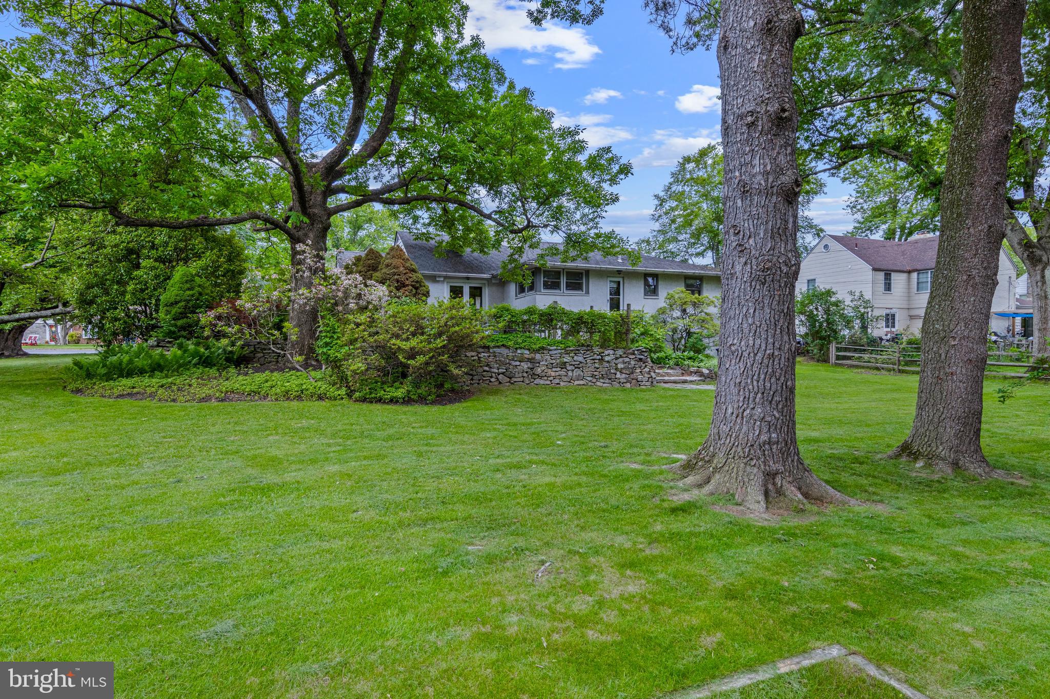413 Hawthorne Road Wallingford, PA 19086 - Photo 40 of 52 a view of a garden with a tree